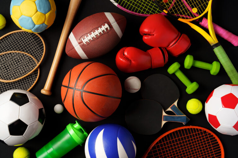 various-sports-equipment-black-background-studio-shot